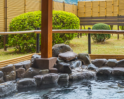 Open-air bath with a view of the Japanese garden
